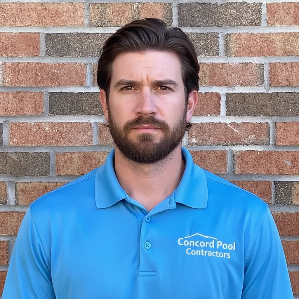 Thomas Smith, owner of Concord Pool Contractors, wearing company branded shirt